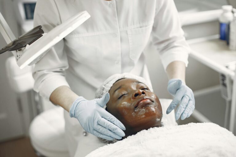 A client enjoys a soothing facial treatment in a modern skincare clinic, promoting wellness and relaxation.