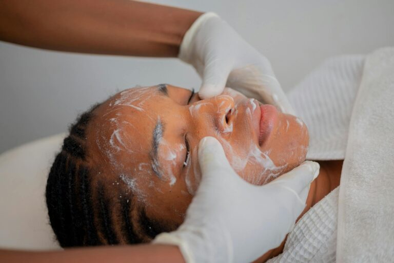Relaxing facial massage at a spa in Abuja, Nigeria, promoting skincare and wellness.